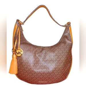 Michael Kors Lydia logo shoulder bag like new condition with charm and tassel